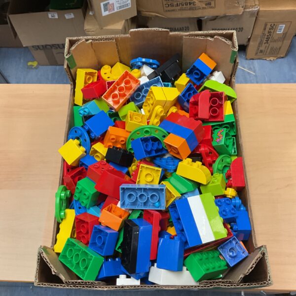 Colourful Duplo blocks in a box, ideal for toddler play.