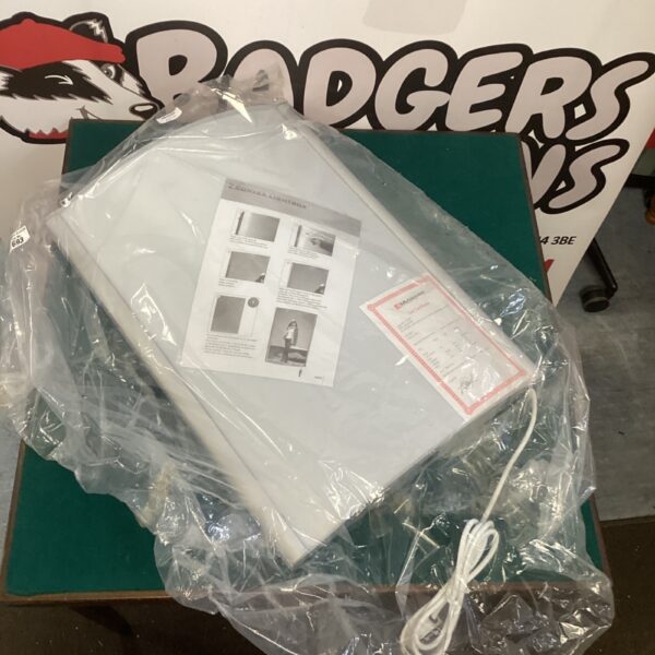New convex lightbox still sealed in original packaging.