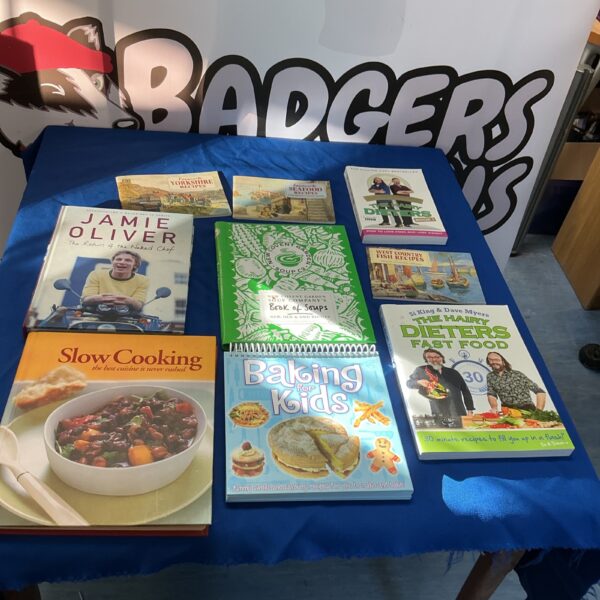 Selection of cooking books including Jamie Oliver titles.