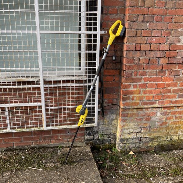 Cordless hedge trimmer for garden maintenance and landscaping.