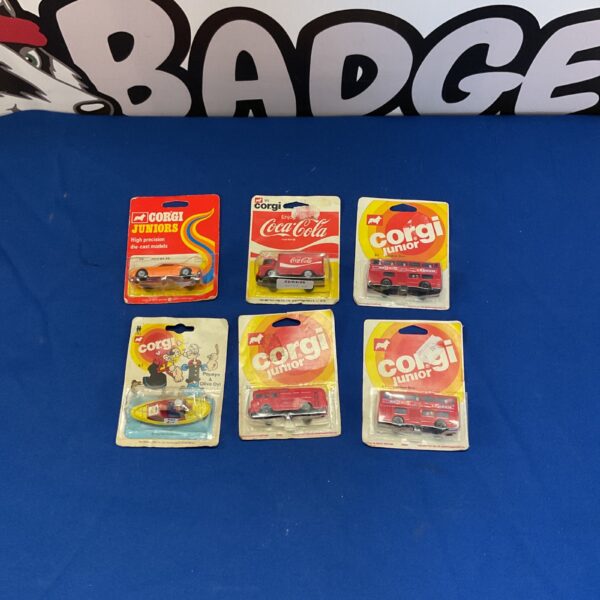 Corgi Junior diecast model lot featuring Coca Cola truck and Popeye.