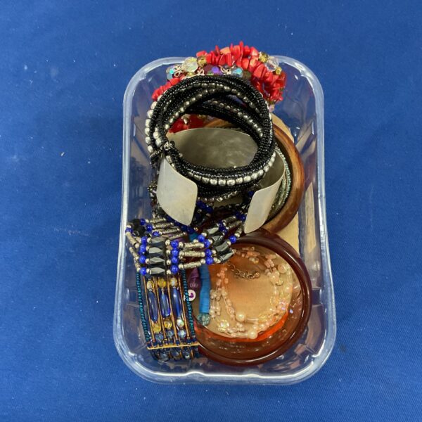 Assorted costume bracelets in a variety of styles and colours.
