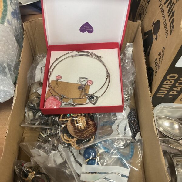 Close-up of a costume jewellery lot with bracelets and necklaces.