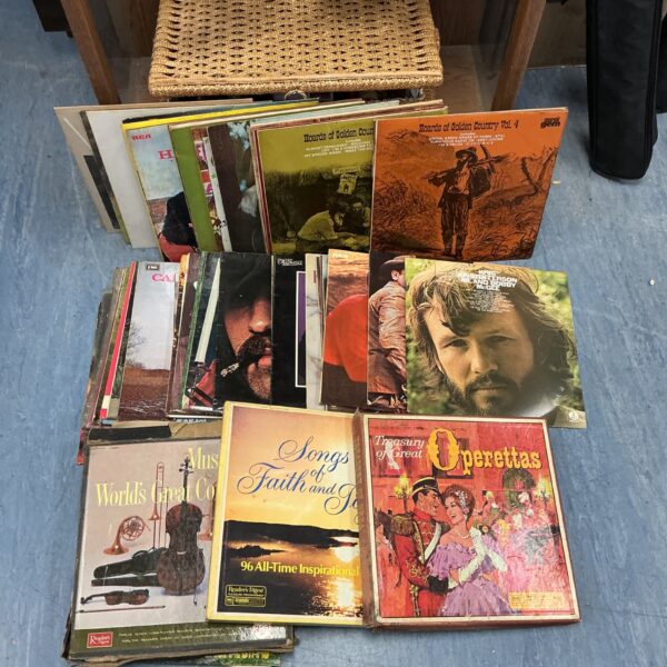 Lot of vintage country music vinyl records with album covers visible.