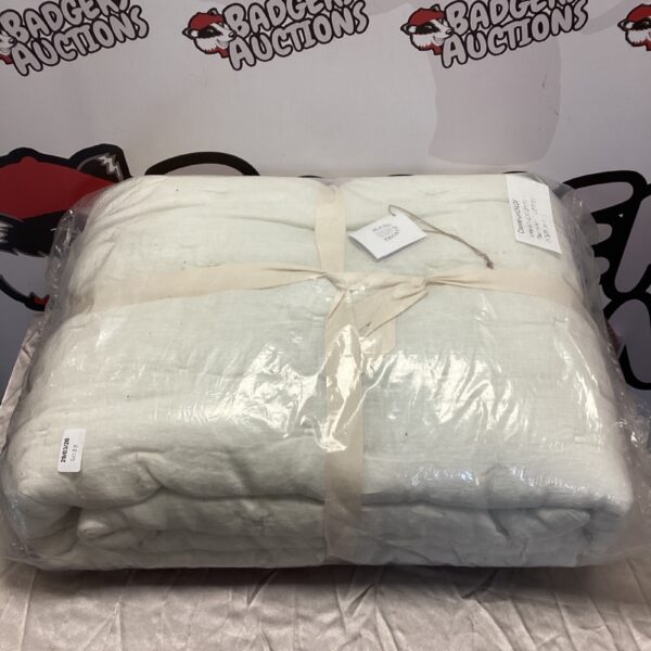 New cream futon cover in original packaging.