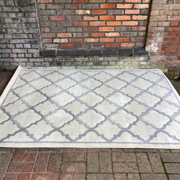Large cream and grey tile pattern rug for living room.