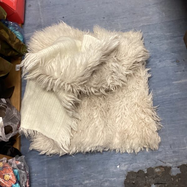 Vintage cream shagpile rugs with a deep textured pile.
