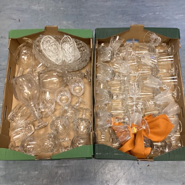 Vintage crystal glassware collection with decanters and serving pieces.