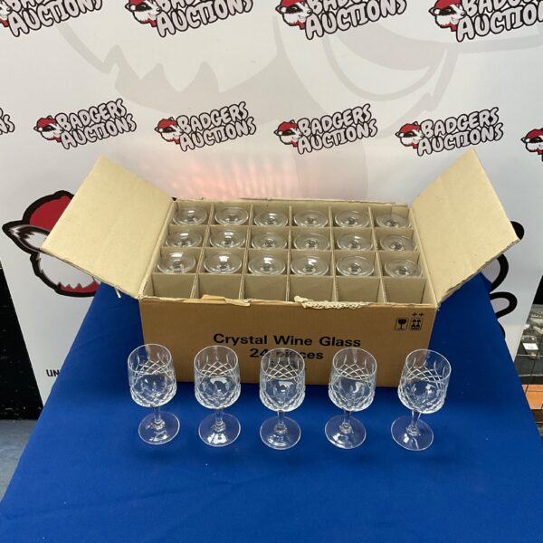 Lot of vintage crystal wine glasses in a box.