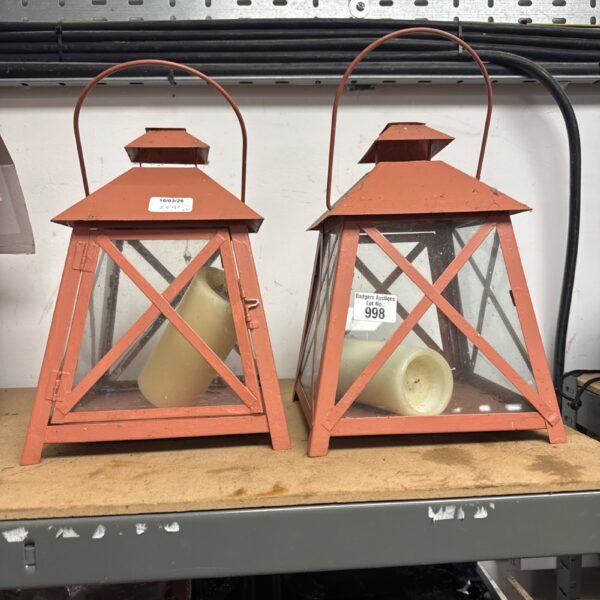 Vintage metal decorative lanterns with candles inside.