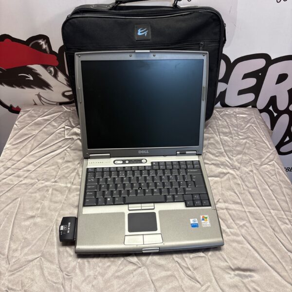 Vintage Dell PP1L laptop with carrying case, retro computing.