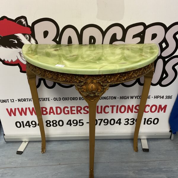 Elegant faux marble demi lune console table with carved legs.