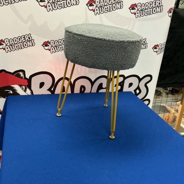 Unique designer three-legged stool with a sculptural form.