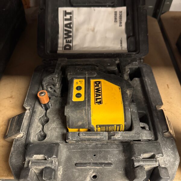 Dewalt DW088K laser level in its case, construction tool.