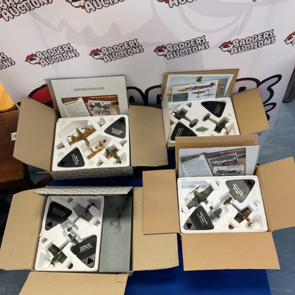 WWII diecast model planes collection in boxes.