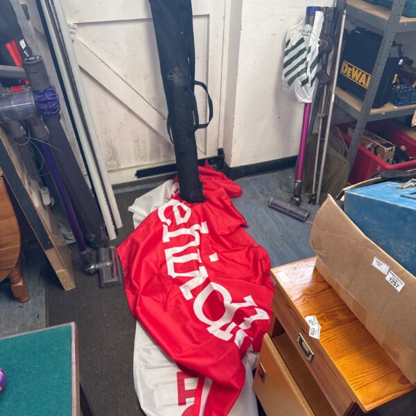Red display banner with Tatehindle branding, promotional signage.