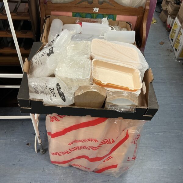 Lot of disposable plastic food containers and cups for catering.
