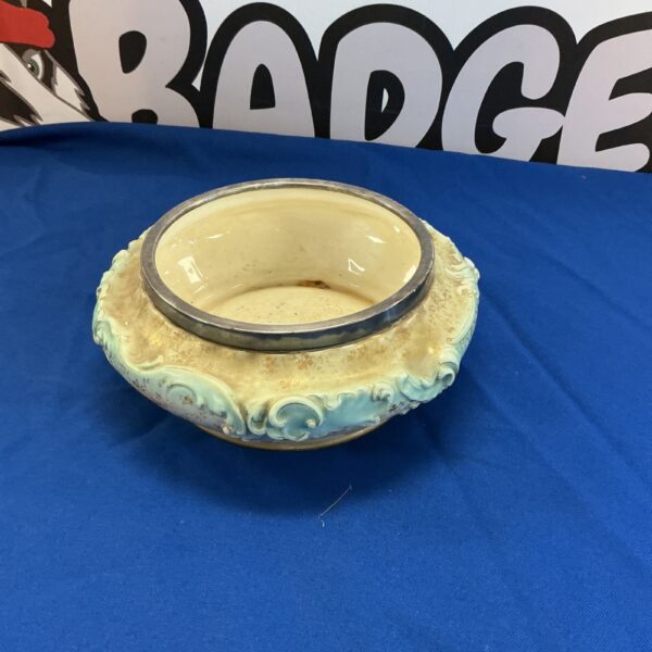 Antique Doulton dish with silverplate rim and floral design.