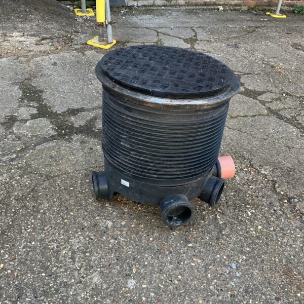 Used plastic driveway drain cover E10APL/25 for outdoor drainage.