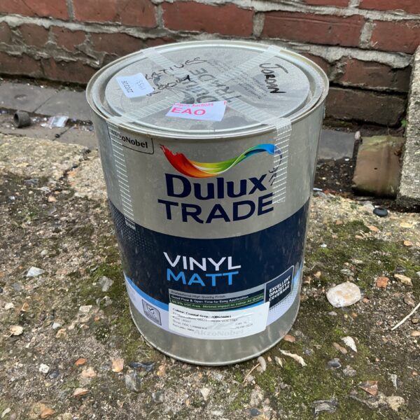 Partially used can of Dulux Trade Vinyl Matt Paint for DIY projects.