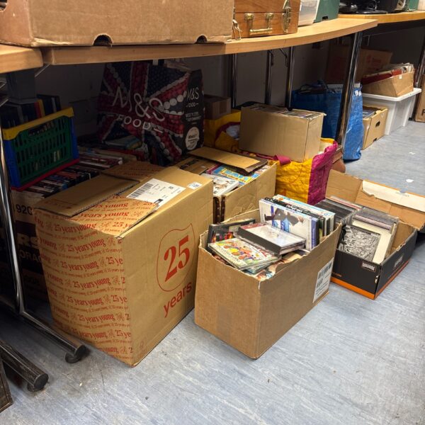 Large job lot of mixed DVDs and CDs for sale.