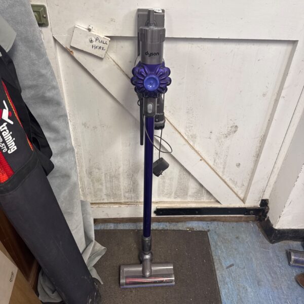 Dyson V8 cordless vacuum cleaner with charger, untested condition.