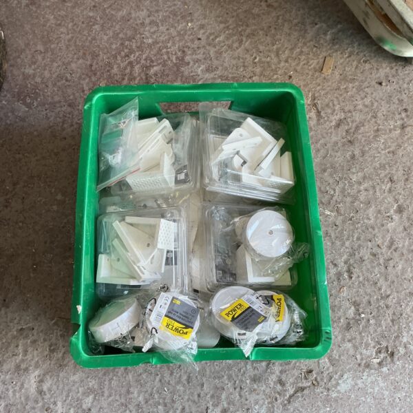 Lot of new electrical junction boxes and brackets for wiring projects.