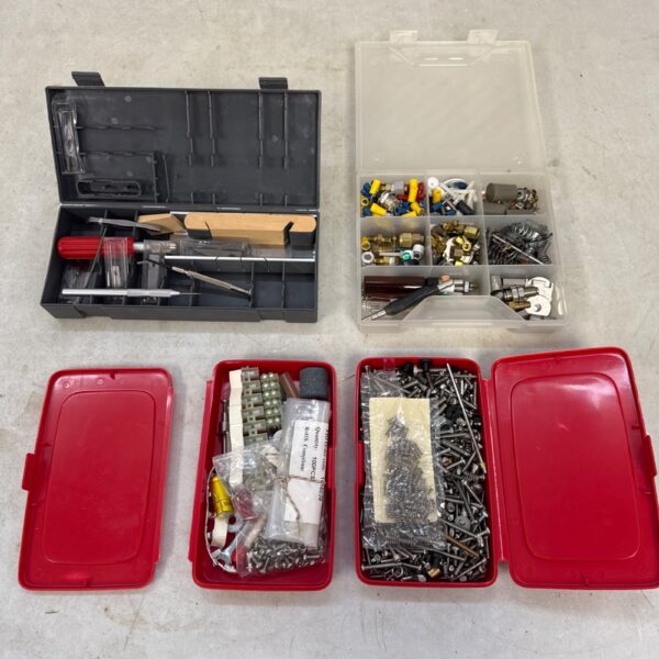 Open plastic case filled with electronics and hardware components.