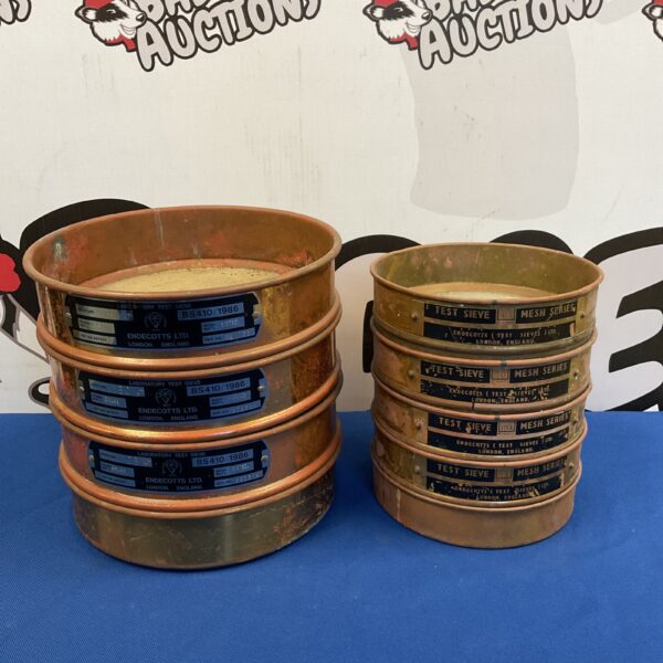 Vintage Endecott Ltd copper test sieves for laboratory analysis.