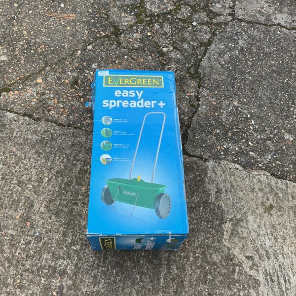 Vintage Evergreen Easy Spreader handheld garden tool for lawn care.