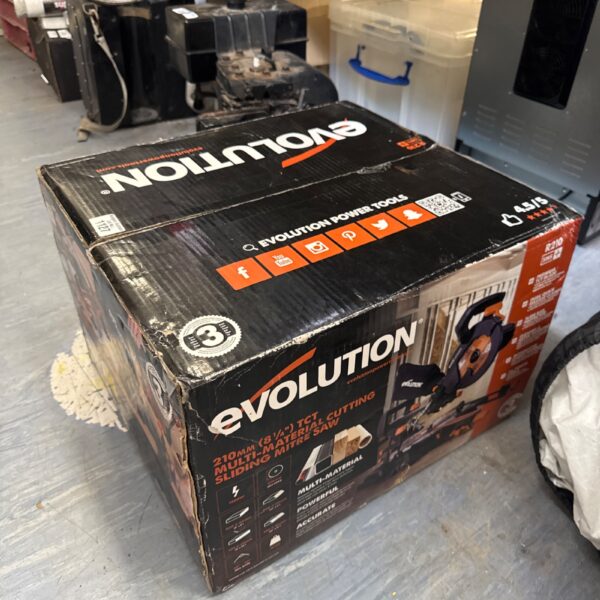 Evolution 210mm electric mitre saw in original packaging.