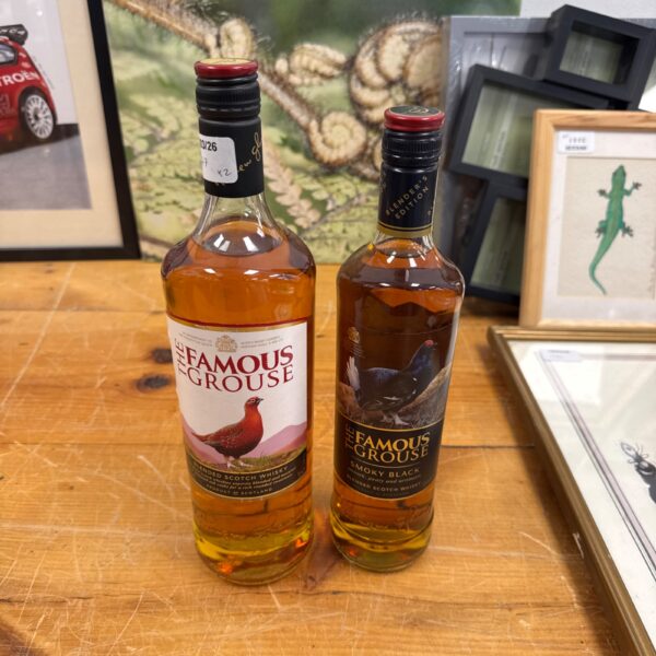 Two bottles of Famous Grouse whisky, including Smoky Black edition.