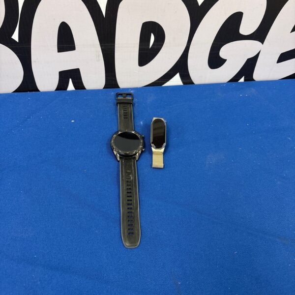 Close-up of a dark-toned fitness watch with a circular display.