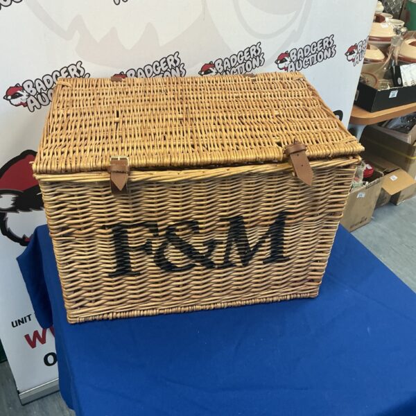 Vintage F&M wicker hamper basket with handle, ideal for storage.