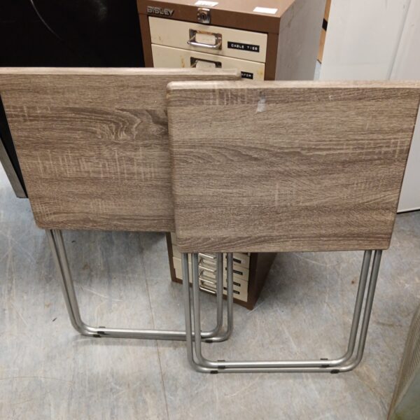 Pair of vintage folding camping tables with metal legs.