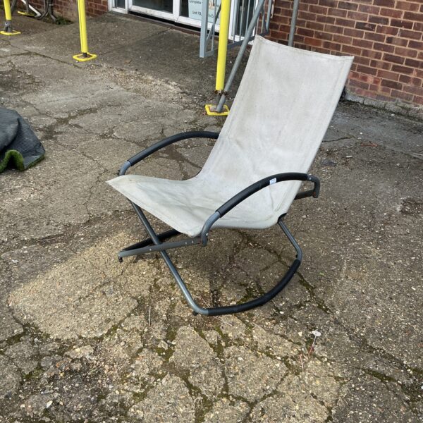 Woven fabric folding garden rocking chair for outdoor use.