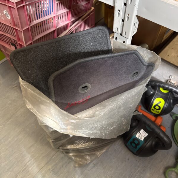 Set of Ford Escort floor mats for car interior protection.