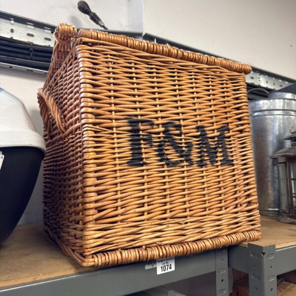 Woven wicker Fortnum and Mason style picnic basket, vintage aesthetic.