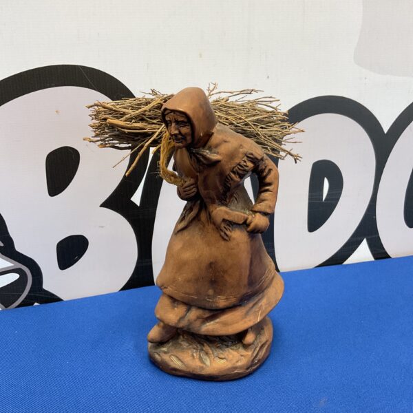 Vintage Francis Lacour santon ornament of a lady gathering wood.
