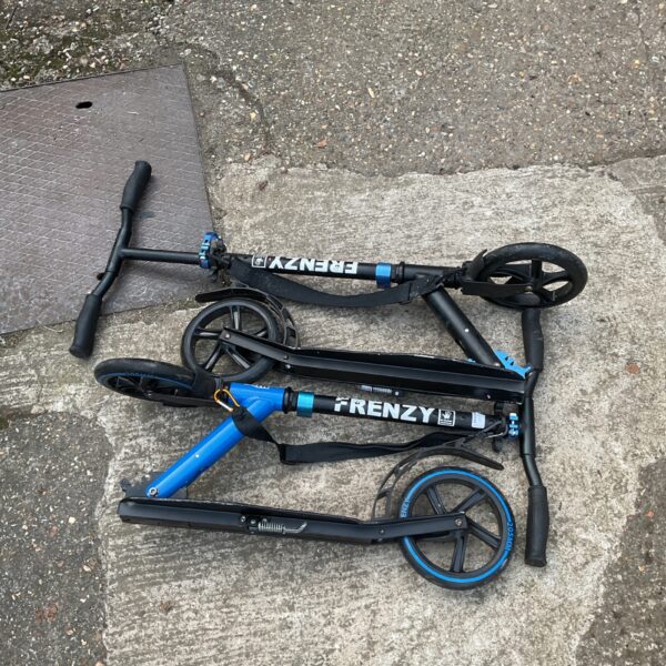 Two folded Frenzy scooters, ideal for kids and outdoor play.