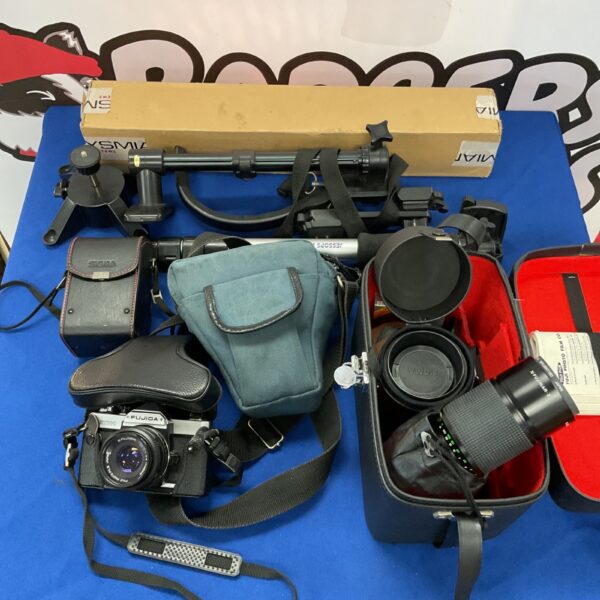 Vintage Fujica STX-1 camera with lenses and accessories.