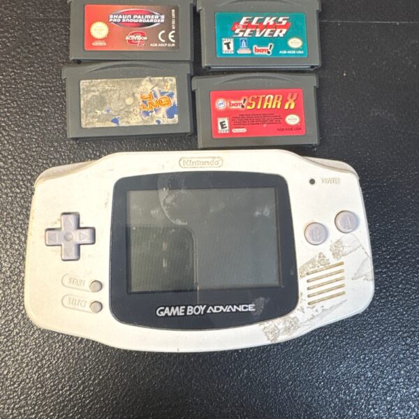 White Nintendo Game Boy Advance console with two game cartridges.