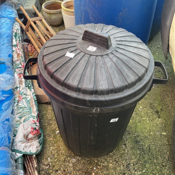 Large plastic garden bin for outdoor storage and waste management.