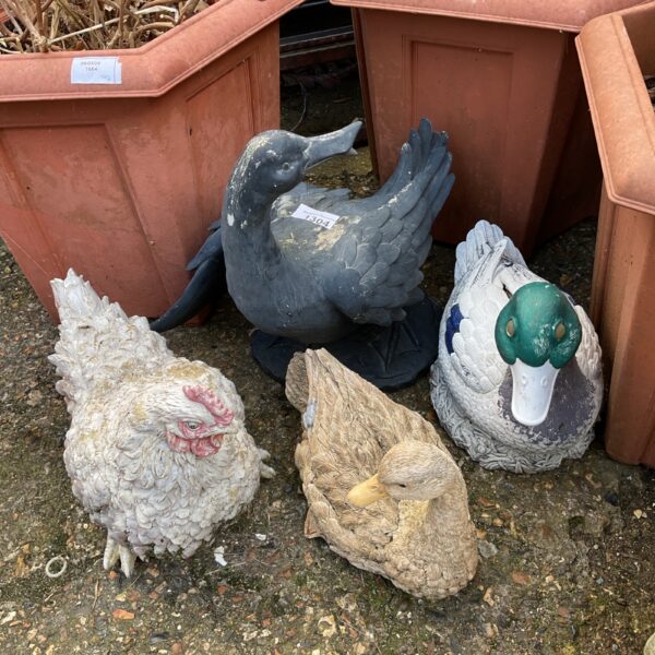 Lot of four colourful plastic garden bird ornaments.