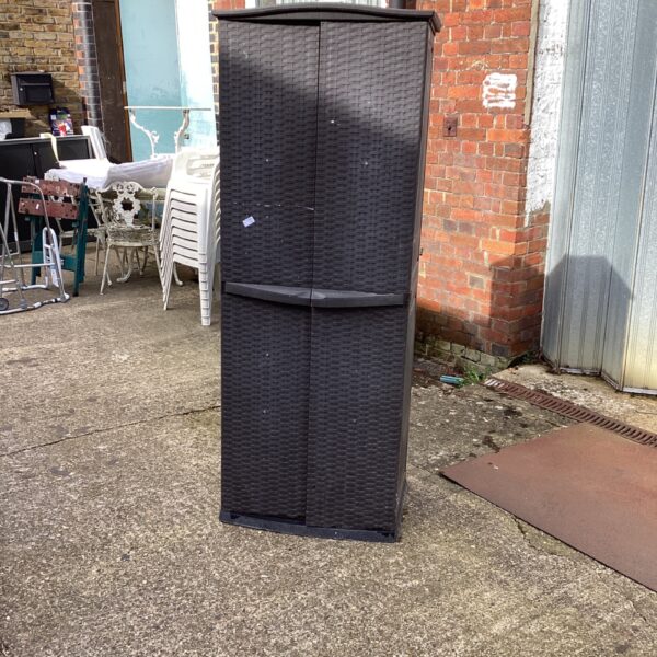 Tall plastic garden storage cabinet for outdoor use.