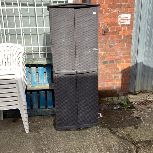 Tall woven plastic garden storage cabinet for outdoor use.