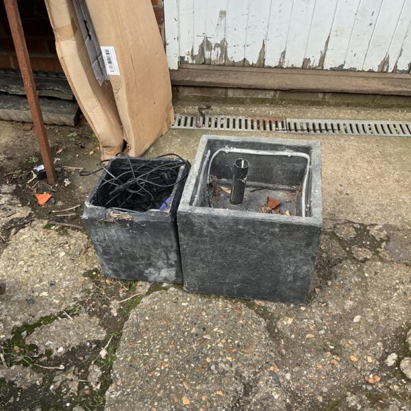 Stone effect garden water feature for outdoor use.