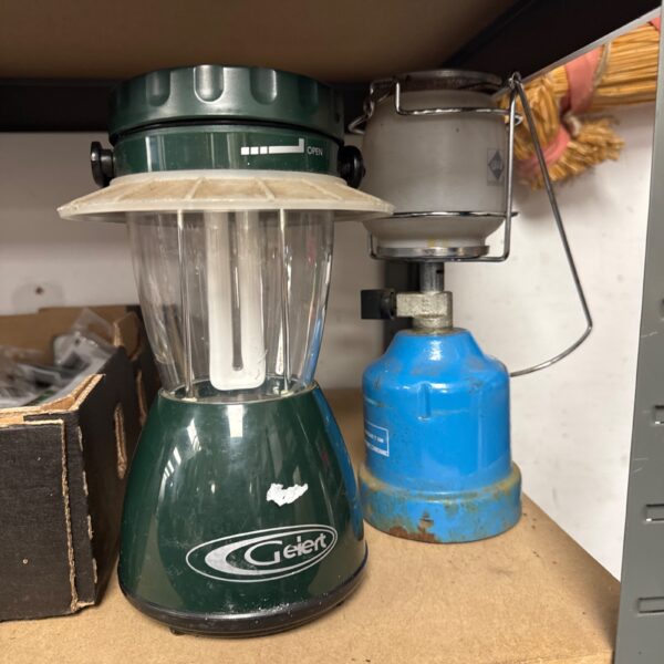 Gelert and Campingaz camping lanterns for outdoor use.