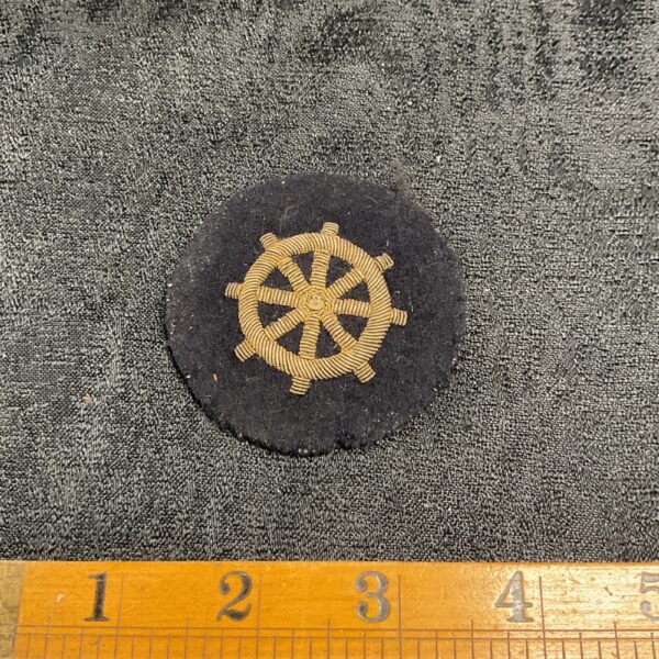Vintage German Merchant Navy arm badge with ships wheel embroidery.