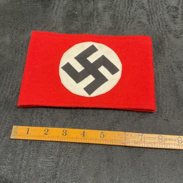 WWII German SA armband with swastika insignia, historical political memorabilia.